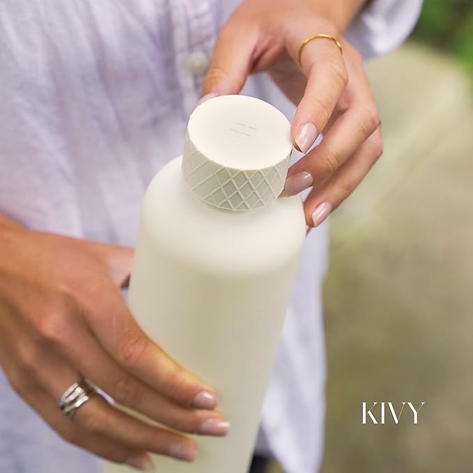 KIVY Slim Water Bottle 32oz [Lightweight & Shatterproof] Fits Backpack & Cupholder for Travel, Sports, School, Gym - Clear water bottle with measurements - Transparent Tritan Black - Dishwasher Safe